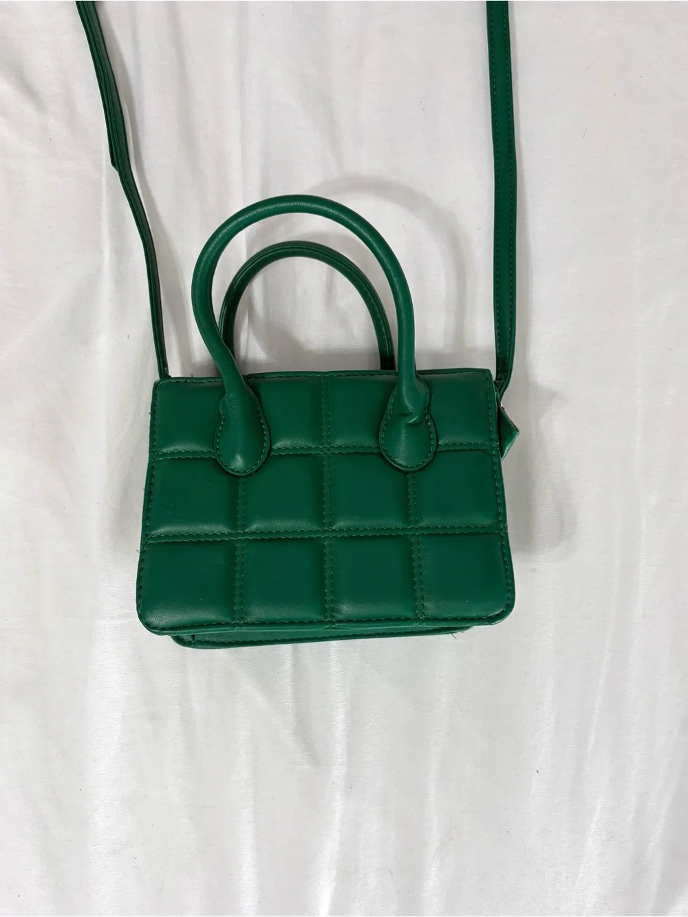 Green quilted mini handbag with removable adjustable crossbody strap